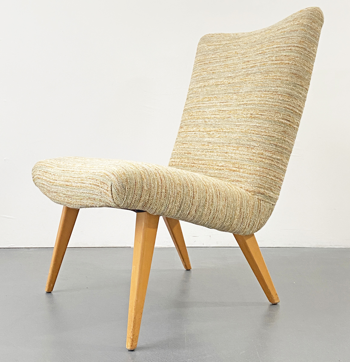Lounge-Chair 1950s / 1960s. Easy Chair with wool cover and wooden feet.