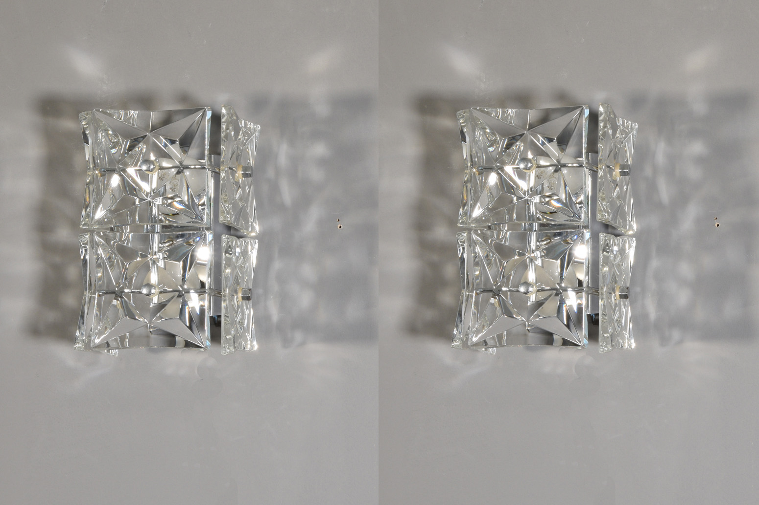 Pair of Scounces / Lamps by Kinkeldey, 1970s. Faceted Crystal Glass, Silver chromed Metal.