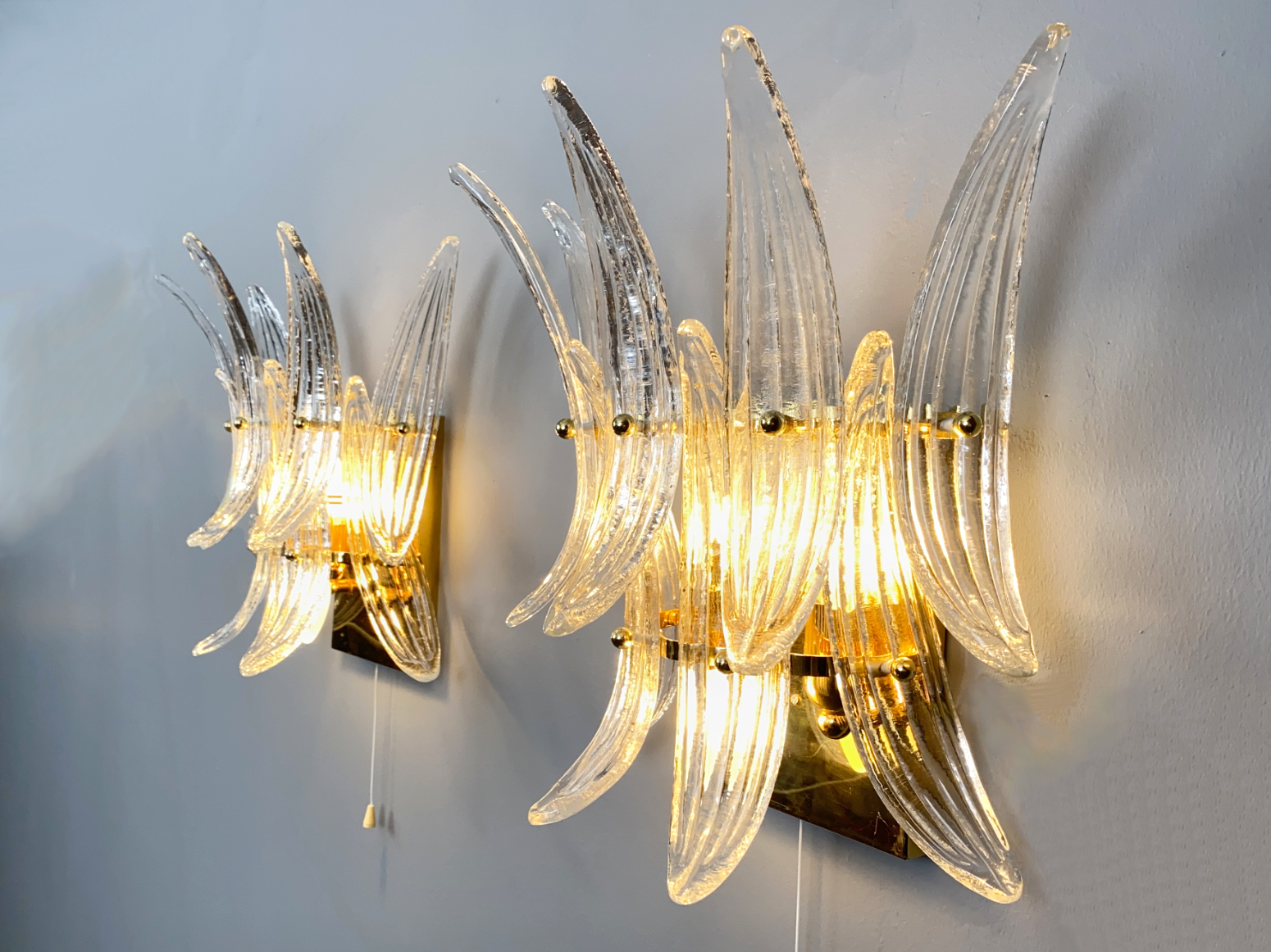Pair of Palmette Sconces / Wall Lamps by J.T. Kalmar Vienna and Glass by Barovier & Toso, Murano, Italy, 1970s.  Each Sconce has 9 Murano Glass Palm Leaves.