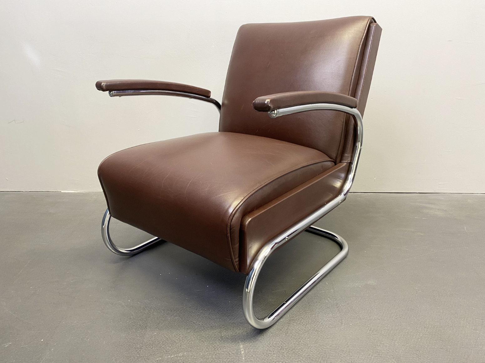 „SOLD“ Armlehnsessel / Easy -Chair / Sessel aus Stahlrohr und braunem Leder von Mücke Melder, 1930s.